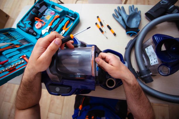 Samsung Service Center technician diagnosing a Samsung vacuum cleaner in Dubai